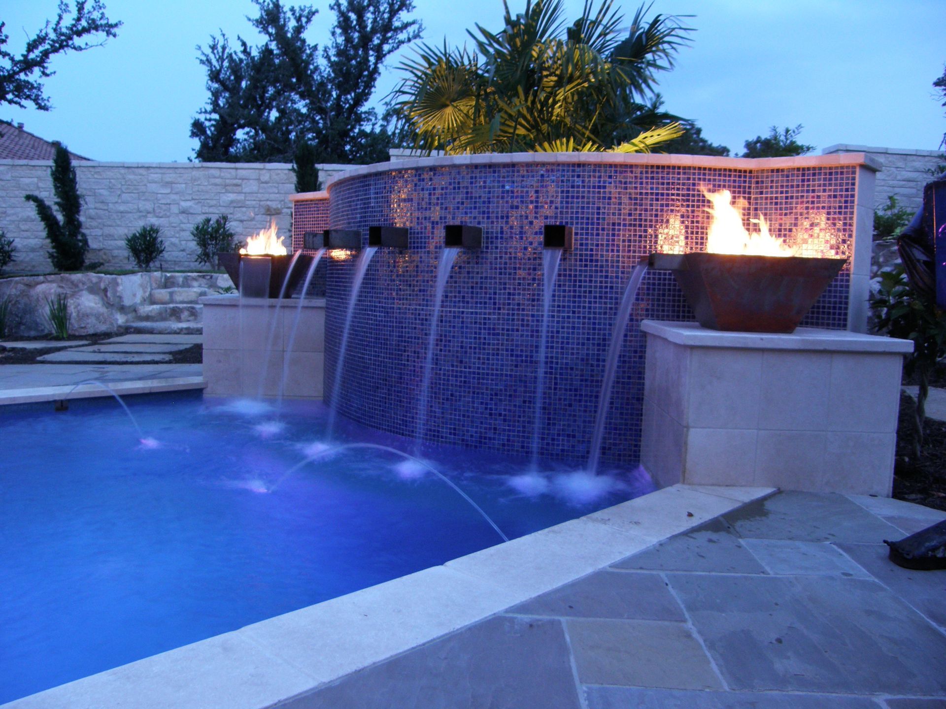 A large house with a swimming pool in front of it