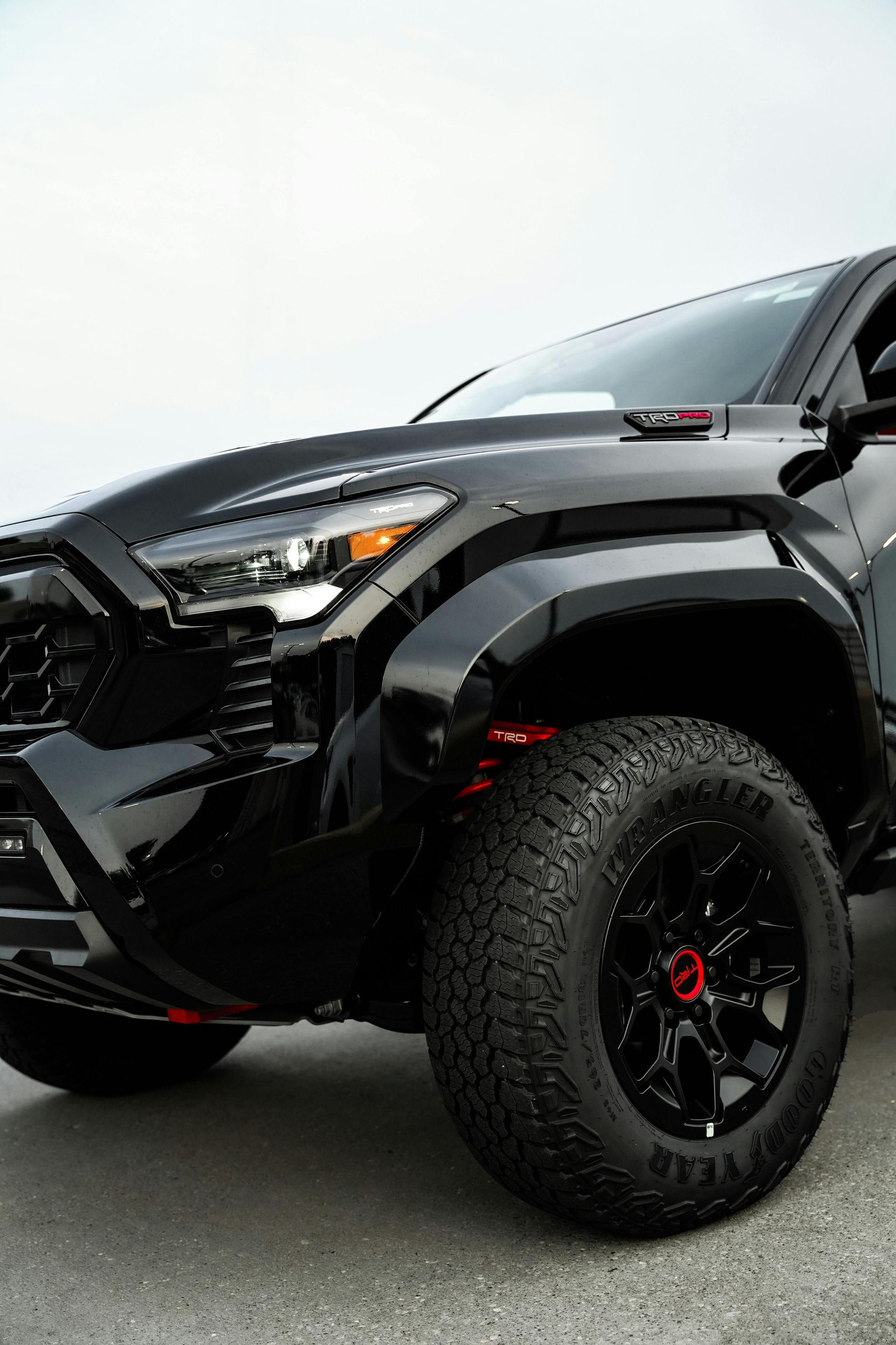 A big black truck ready to pickup passengers