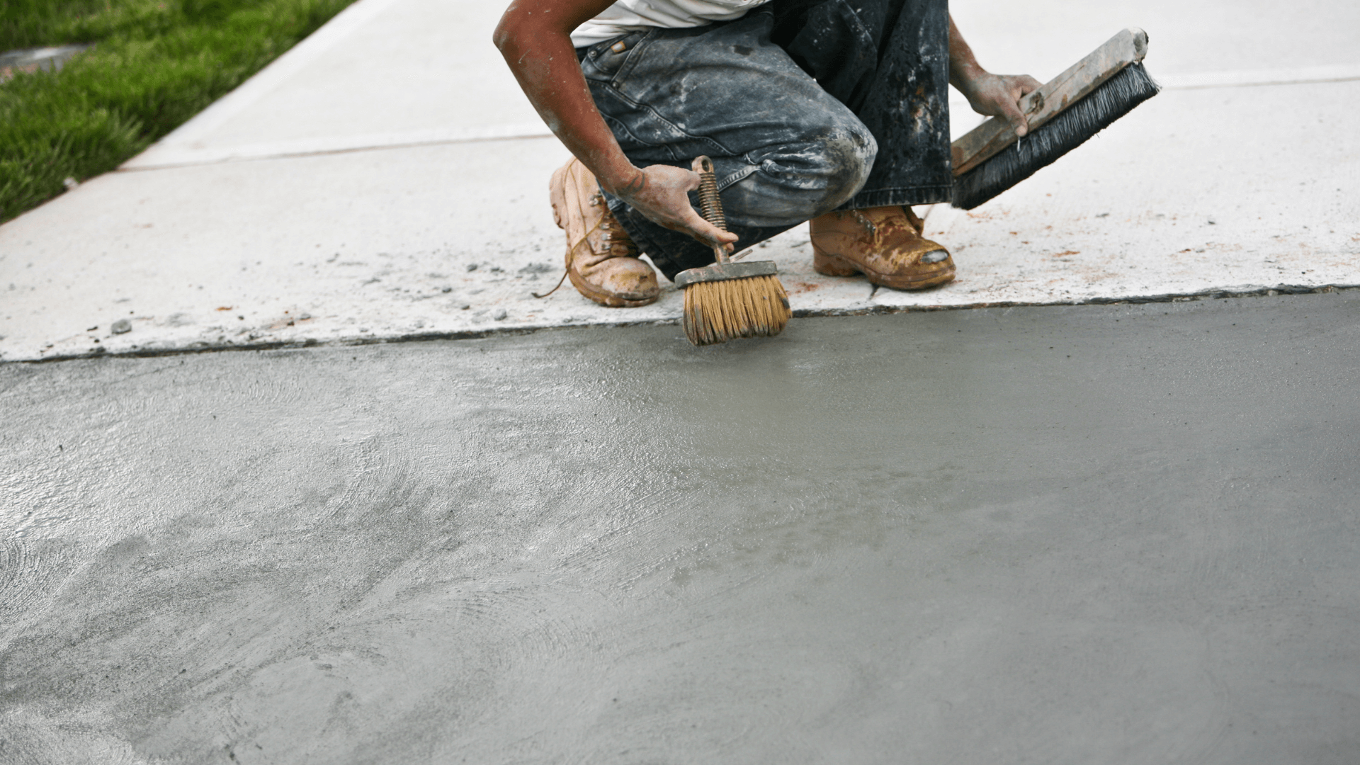 Concrete contractor finishes a sidewalk in Naperville