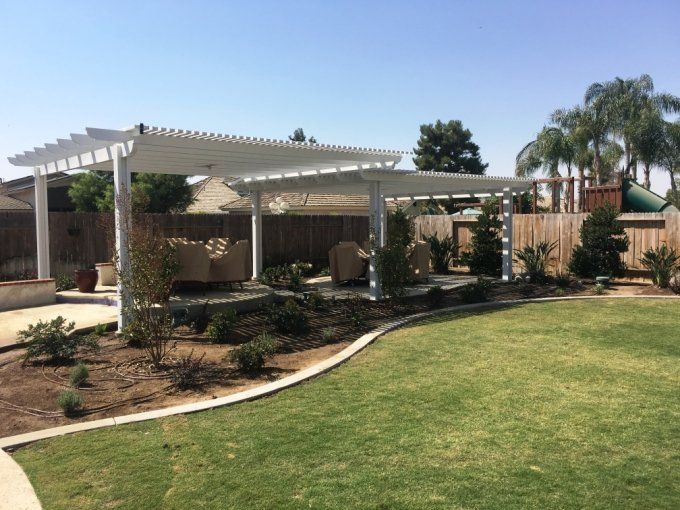 Curved Garden With White Roofing – Bakersfield, CA – Bakersfield Patios Covers
