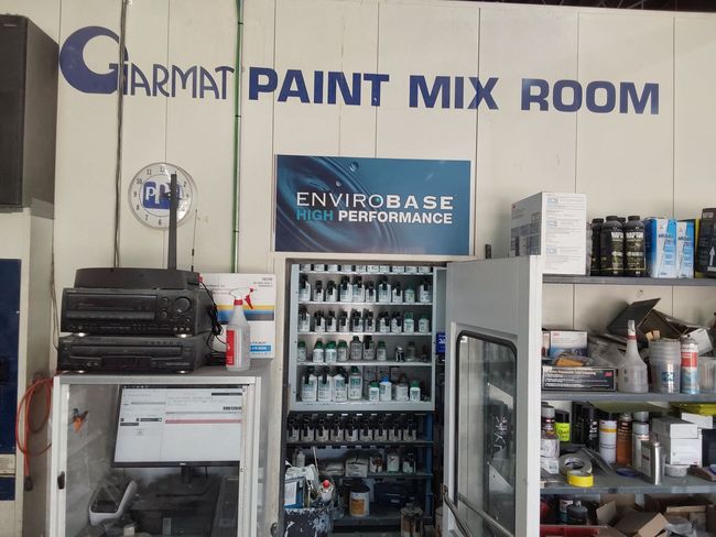 A paint mix room with a sign that says environment high performance