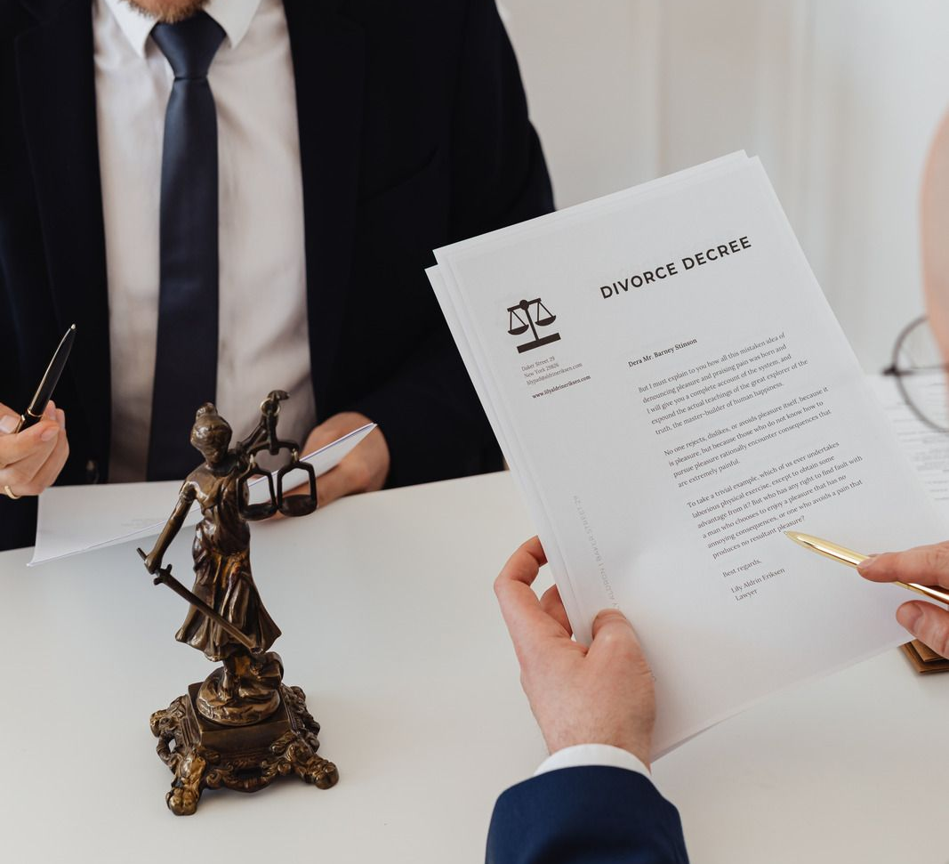 Luxurious white mansion with black windows, columns, palm trees, and a clear blue sky.