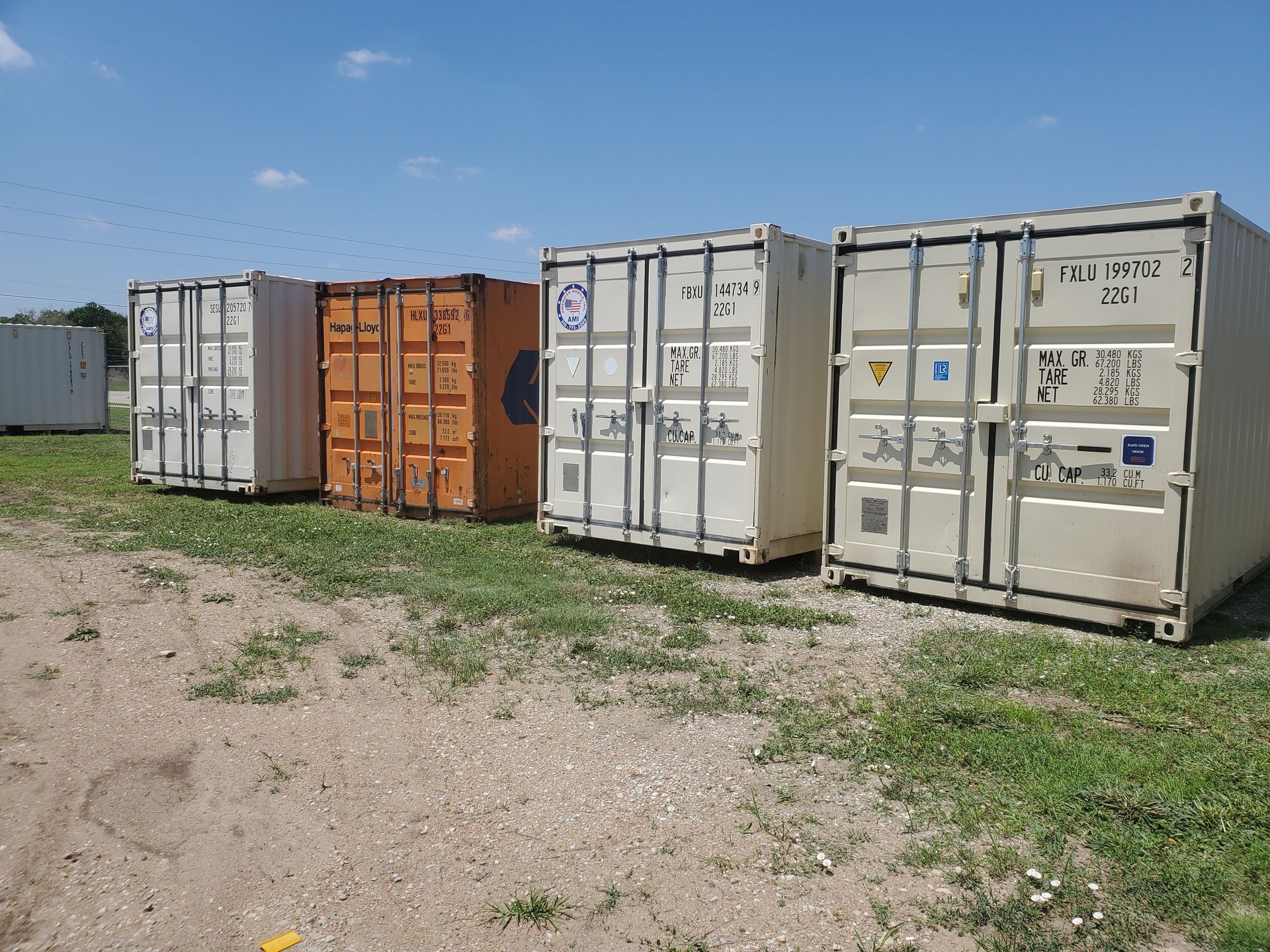 Line of 4 40 Ft shipping containers for sale at American Mobile Inc. Stockton KS location