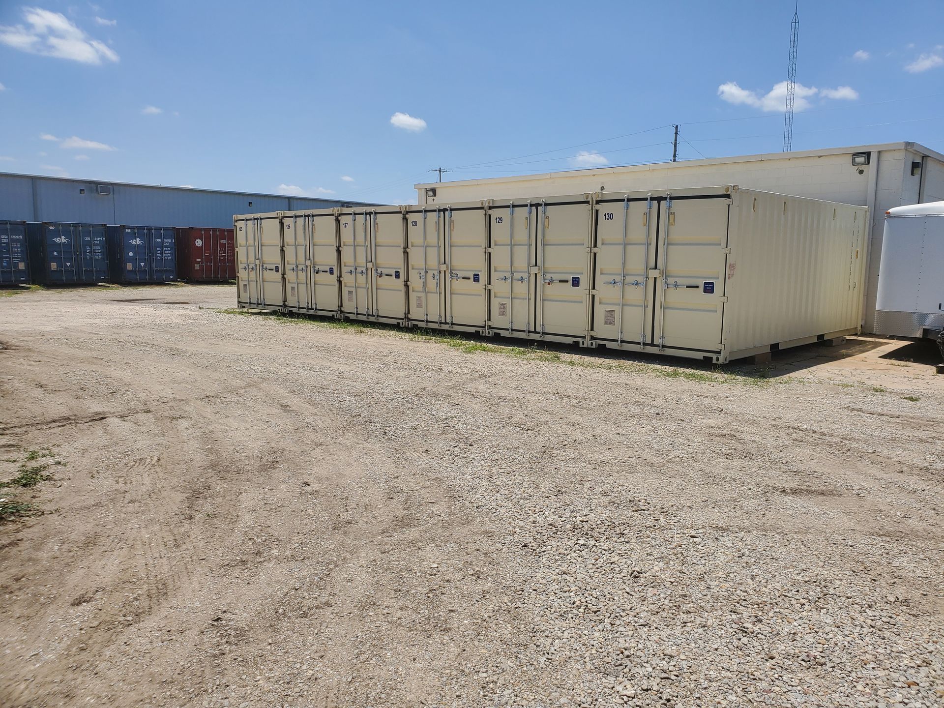 Line of 4 40 Ft shipping containers for sale at American Mobile Inc. Stockton KS location