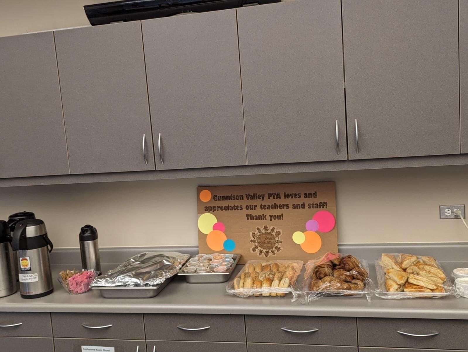 A kitchen counter with a sign that says thank you