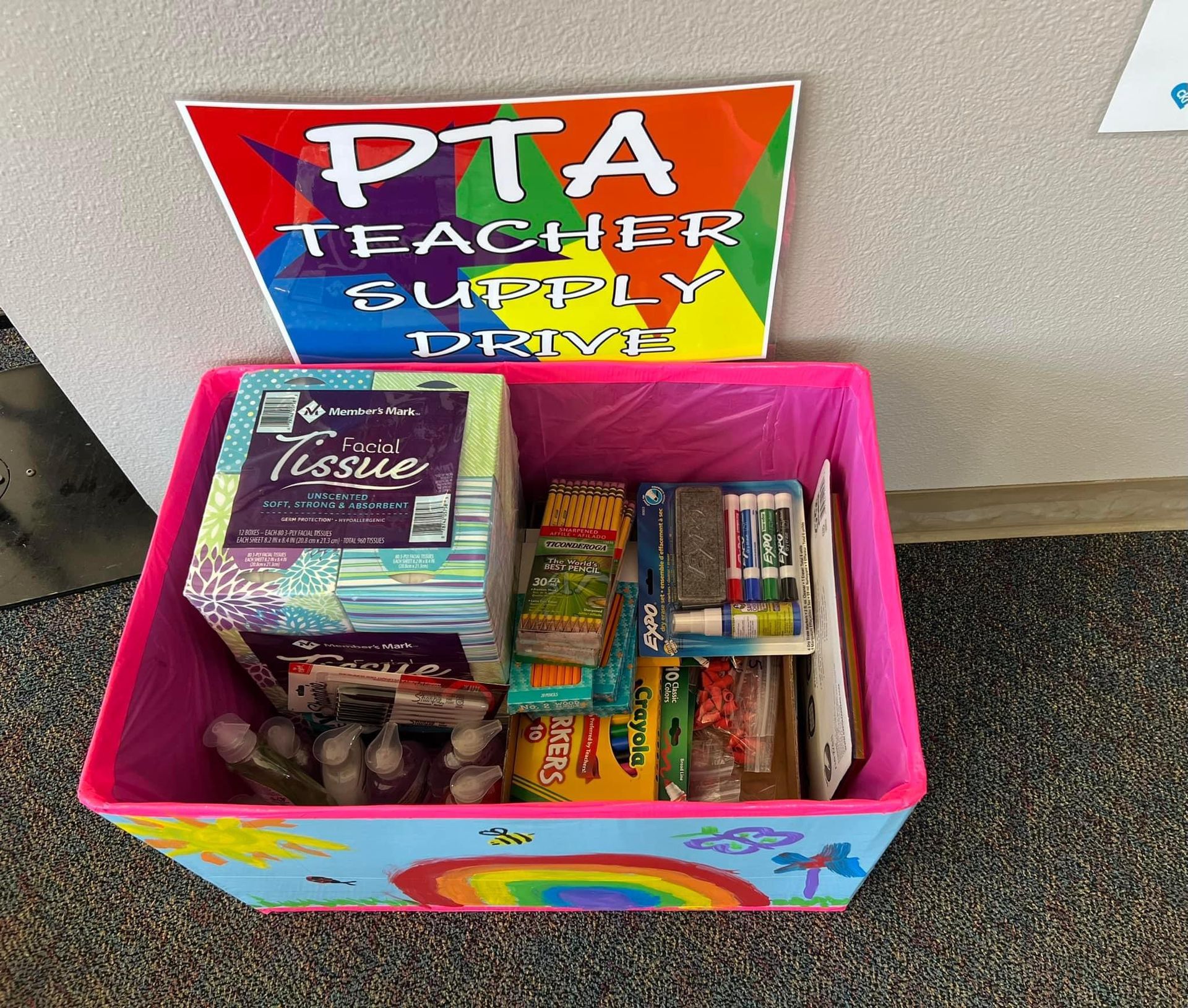 A long table with boxes and tissues on it