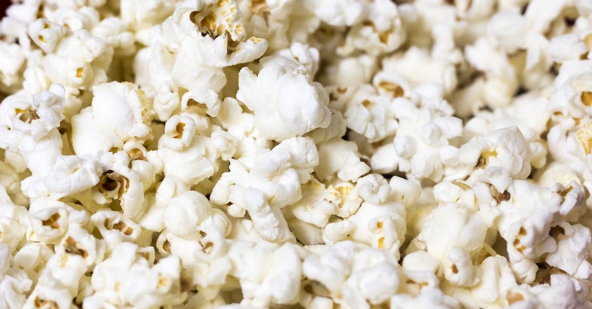 A close up of a bowl of popcorn on a table.