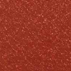 Textured reddish-brown surface with small, lighter flecks throughout.