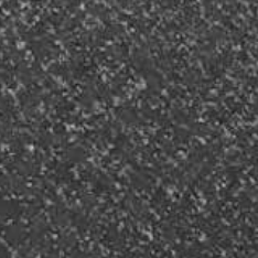 Dark gray textured surface with small, lighter flecks.
