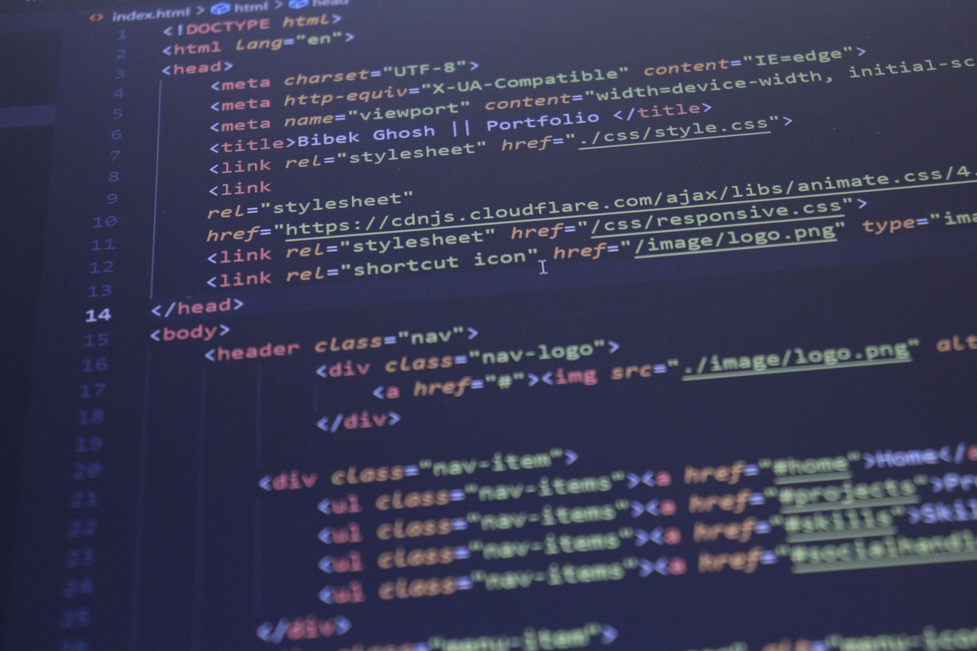 Close-up of code on a computer screen with HTML and CSS syntax highlighted in blue and purple