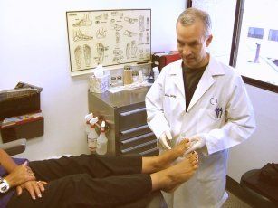 Heel Pain — Doctor Checking the Foot in the Clinic in Reno, NV