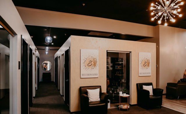A woman is getting her hair done at a salon.