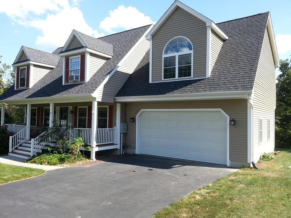 a large house with a garage and a porch