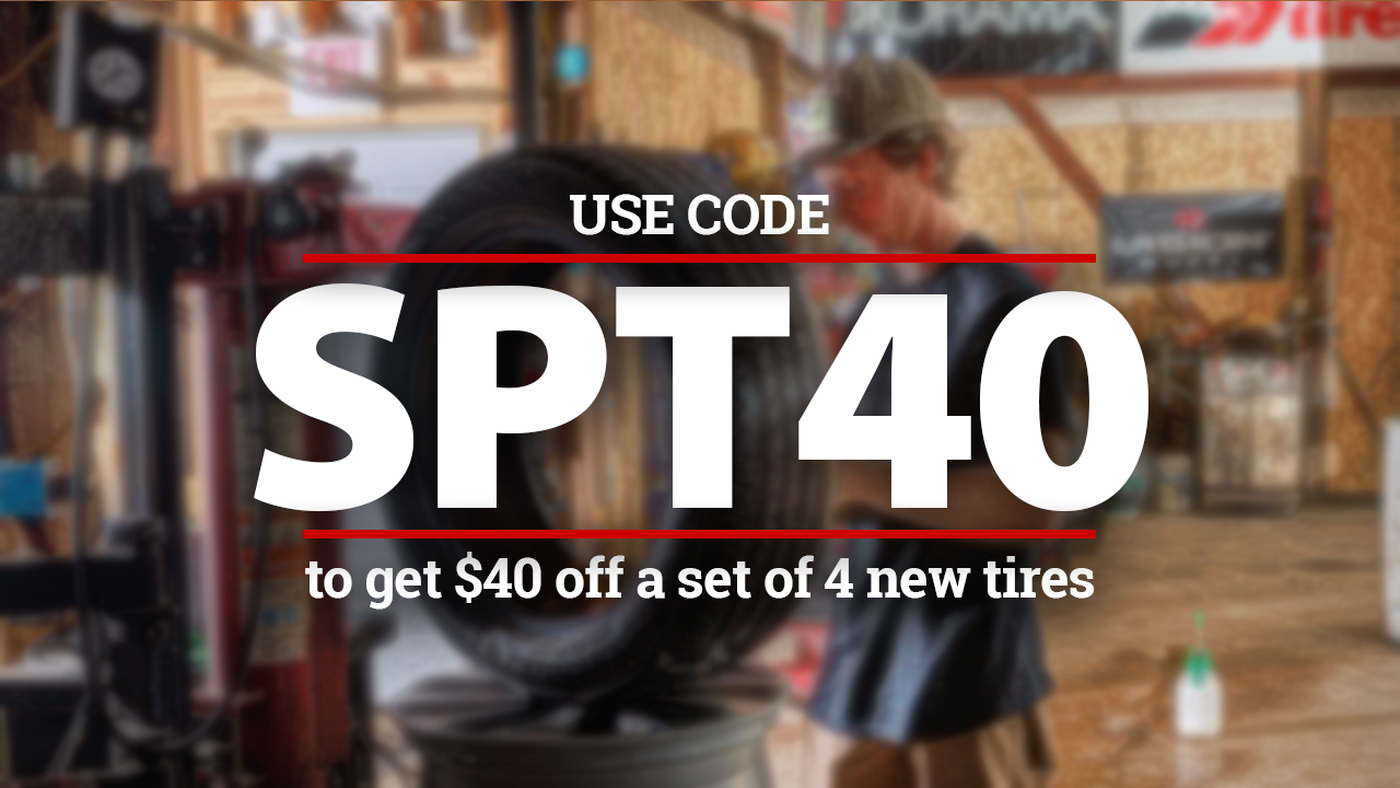 Promotional image: Coupon code SPT40 for $40 off a set of 4 new tires, mechanic with a tire in a shop.