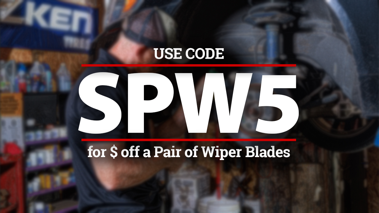 Mechanic working on a car, with text: 