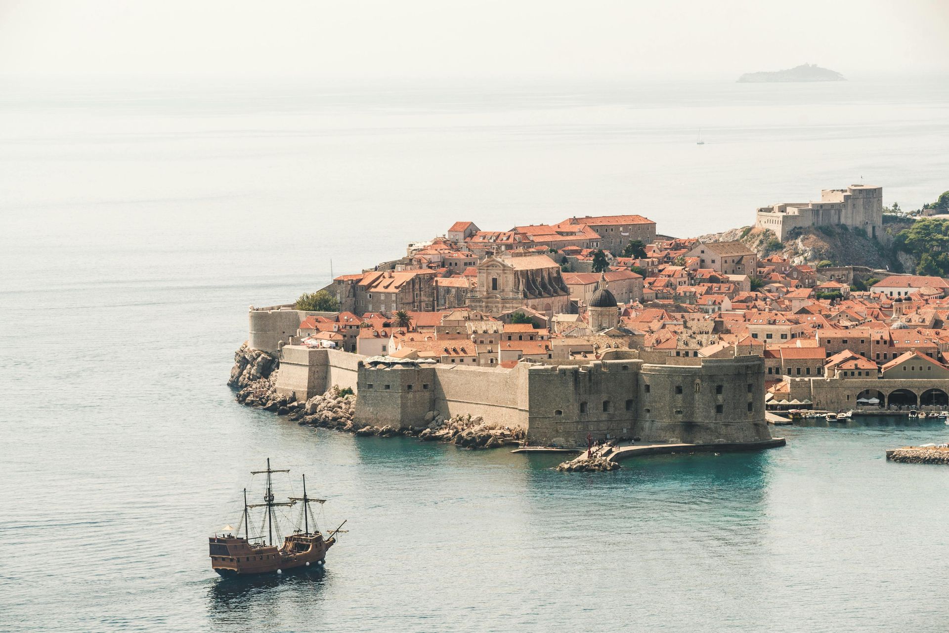 A boat is floating in the water near Dubrovnik's Old Town 