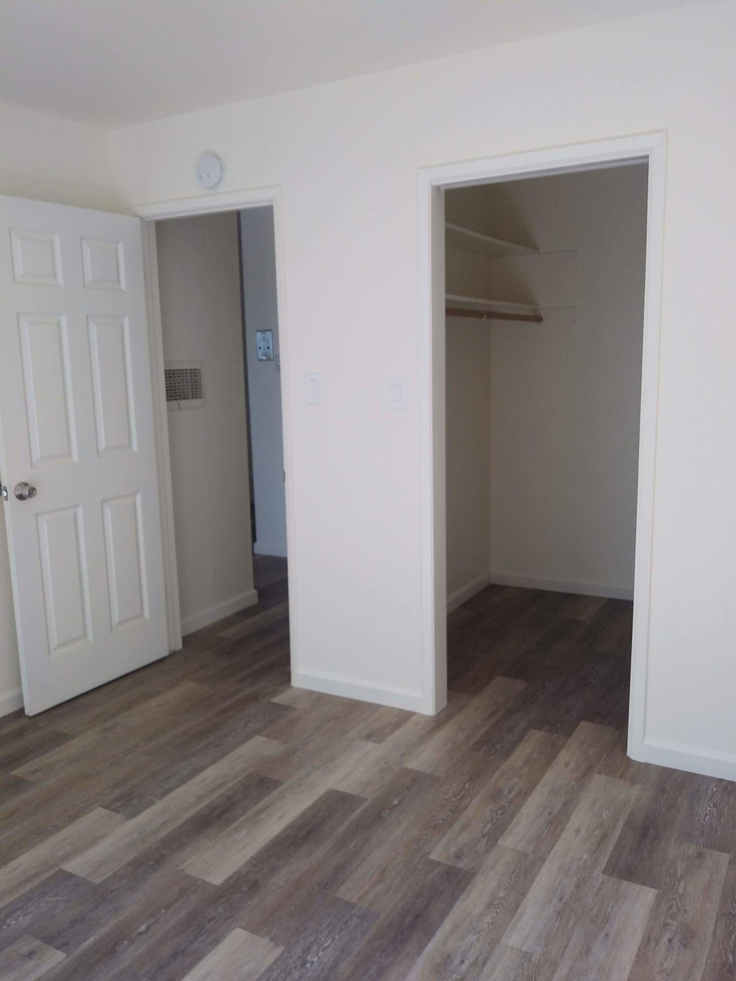 there is a closet in the middle of the room .