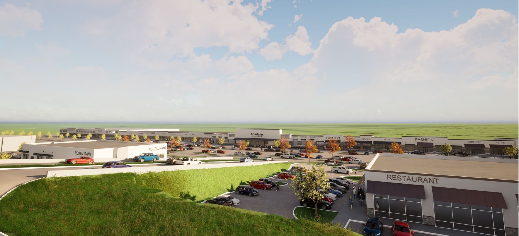 An aerial view of a shopping center with a lot of cars parked in front of it