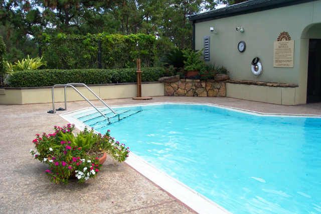 A large swimming pool with a staircase leading to it