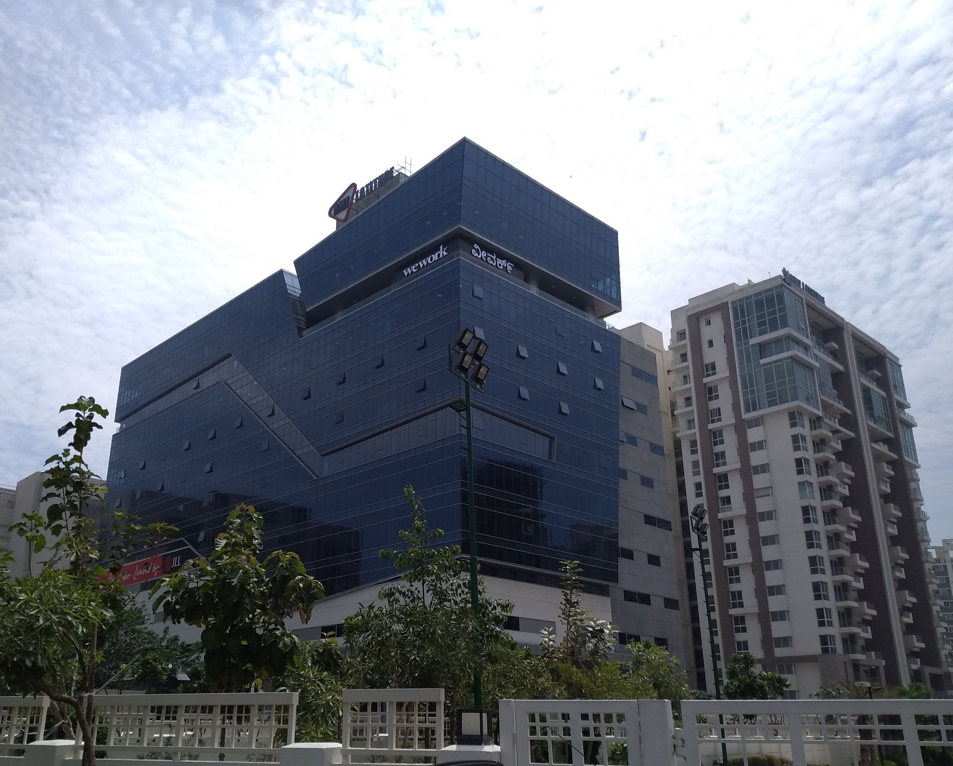A large building with a blue sky in the background