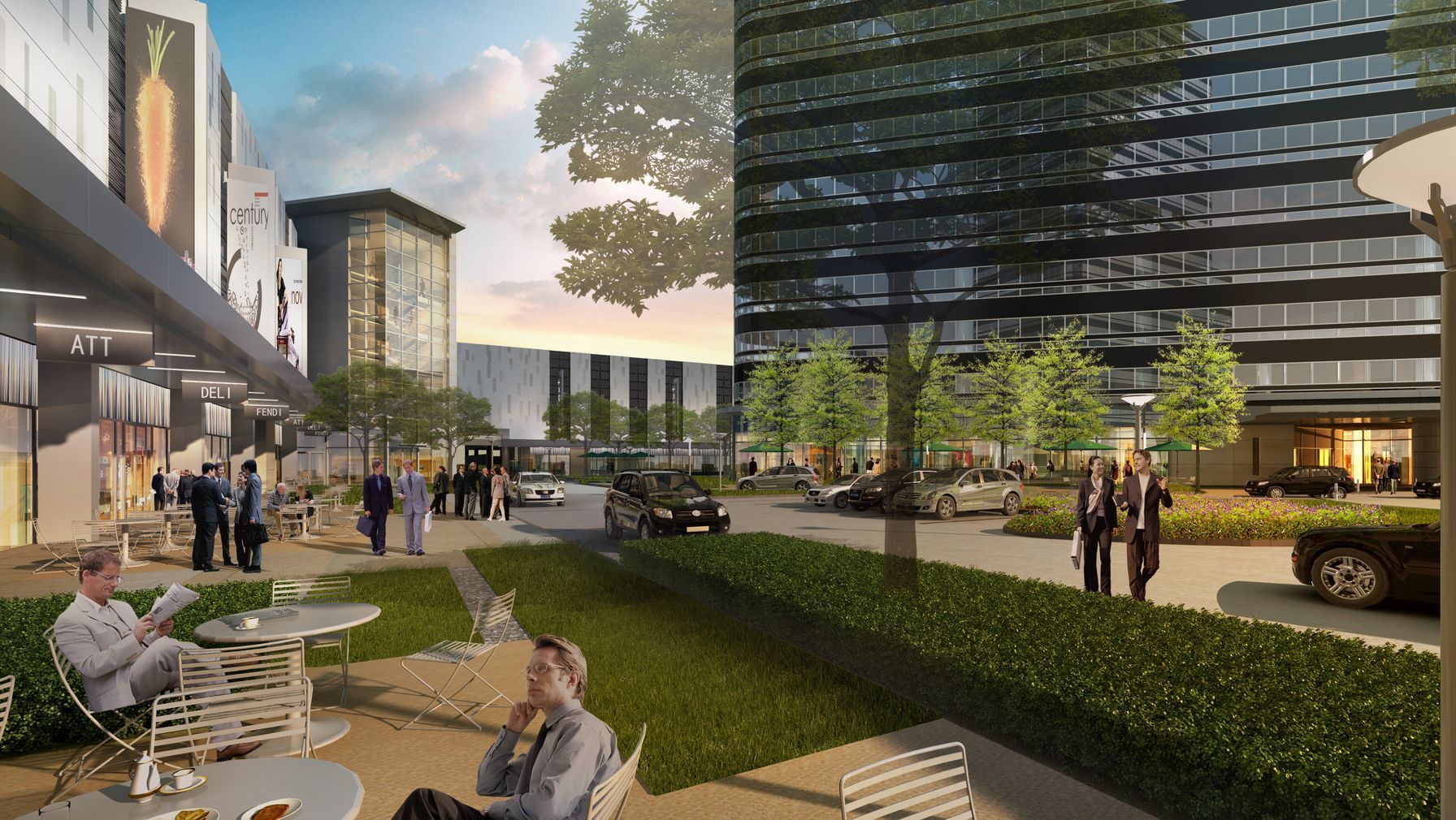 A man is sitting at a table in a park in front of a building.