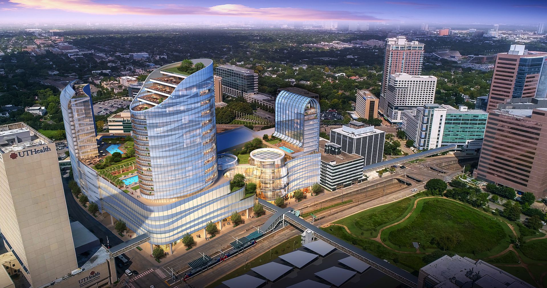 An aerial view of a city with a lot of buildings and trees.