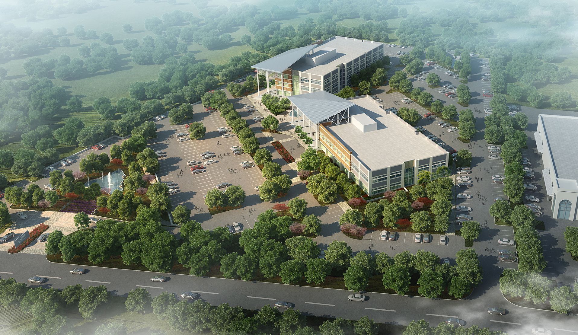 An aerial view of a large building surrounded by trees