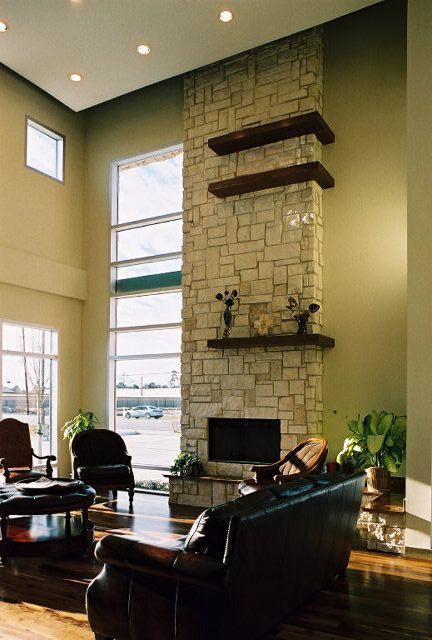 A living room with a fireplace and a couch