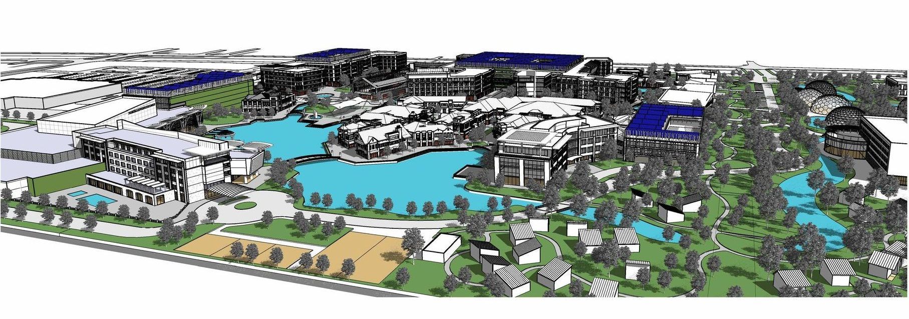 An aerial view of a lake surrounded by trees and buildings.