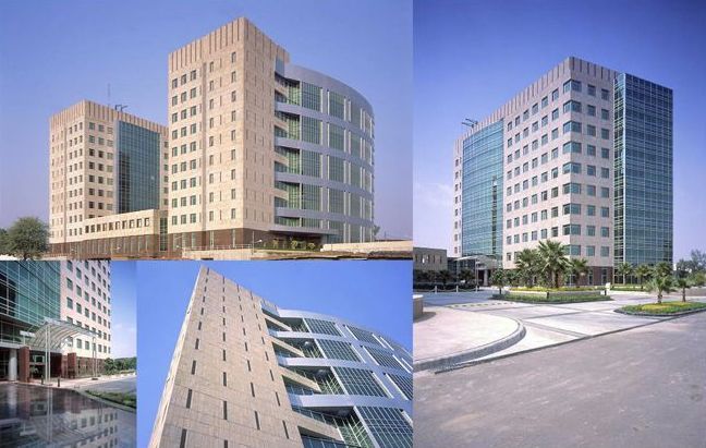 A collage of four pictures of a tall building