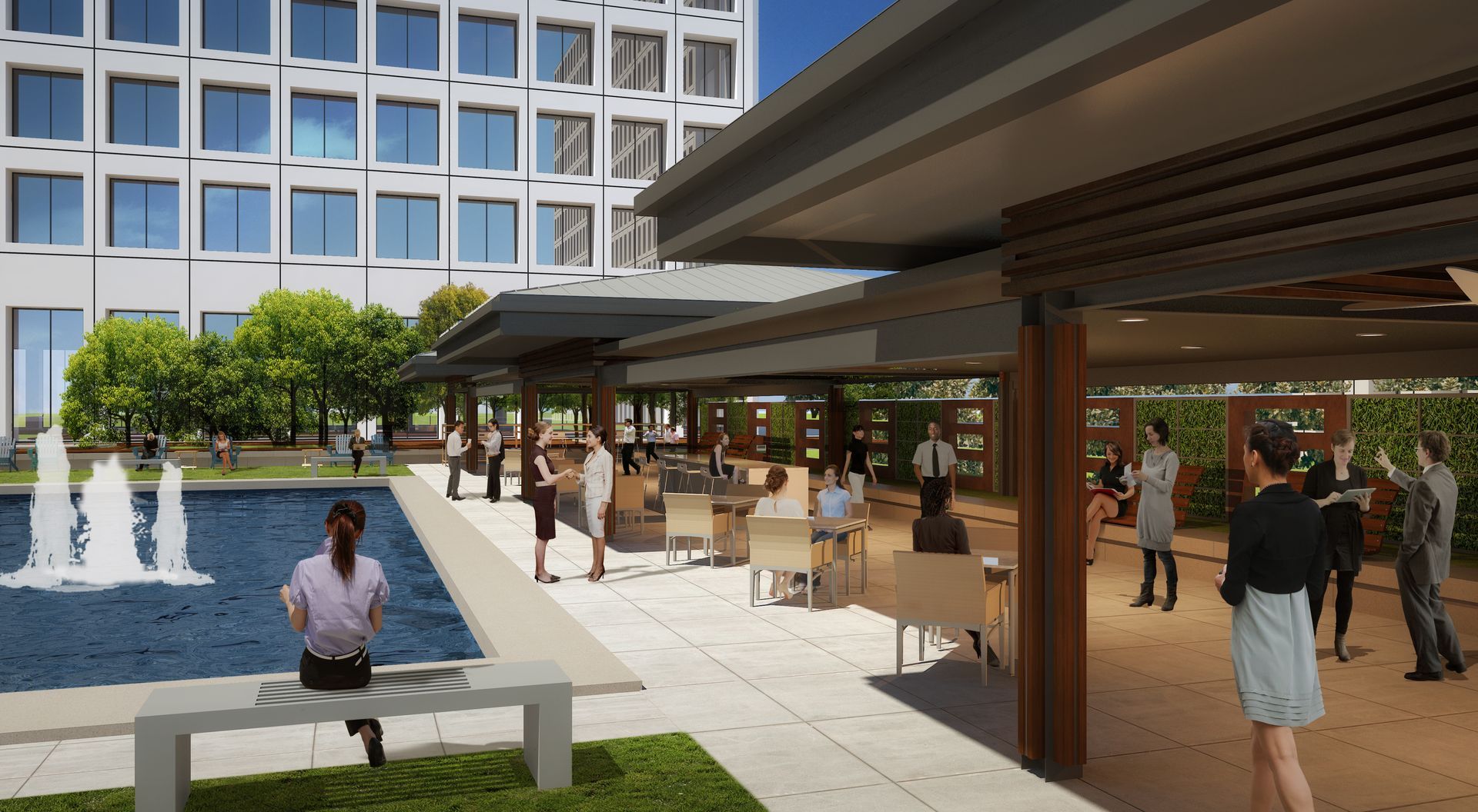 A group of people are standing around a fountain in a park.