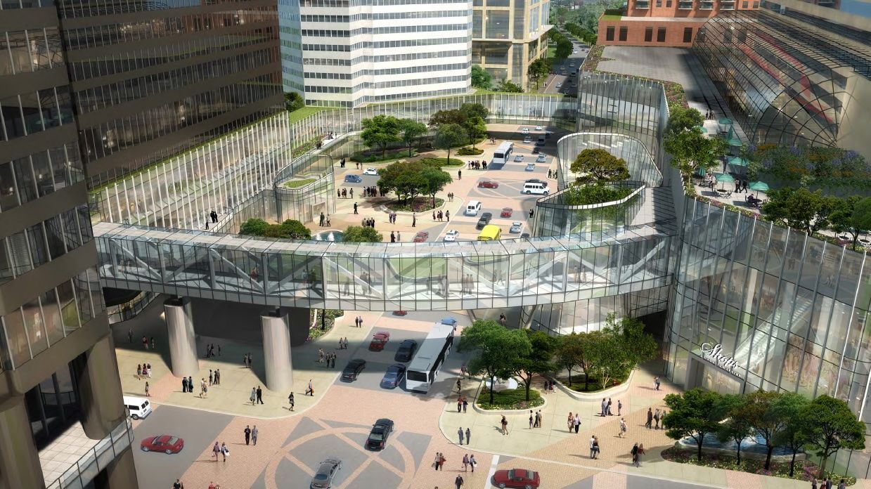 An aerial view of a city with a lot of people and cars.