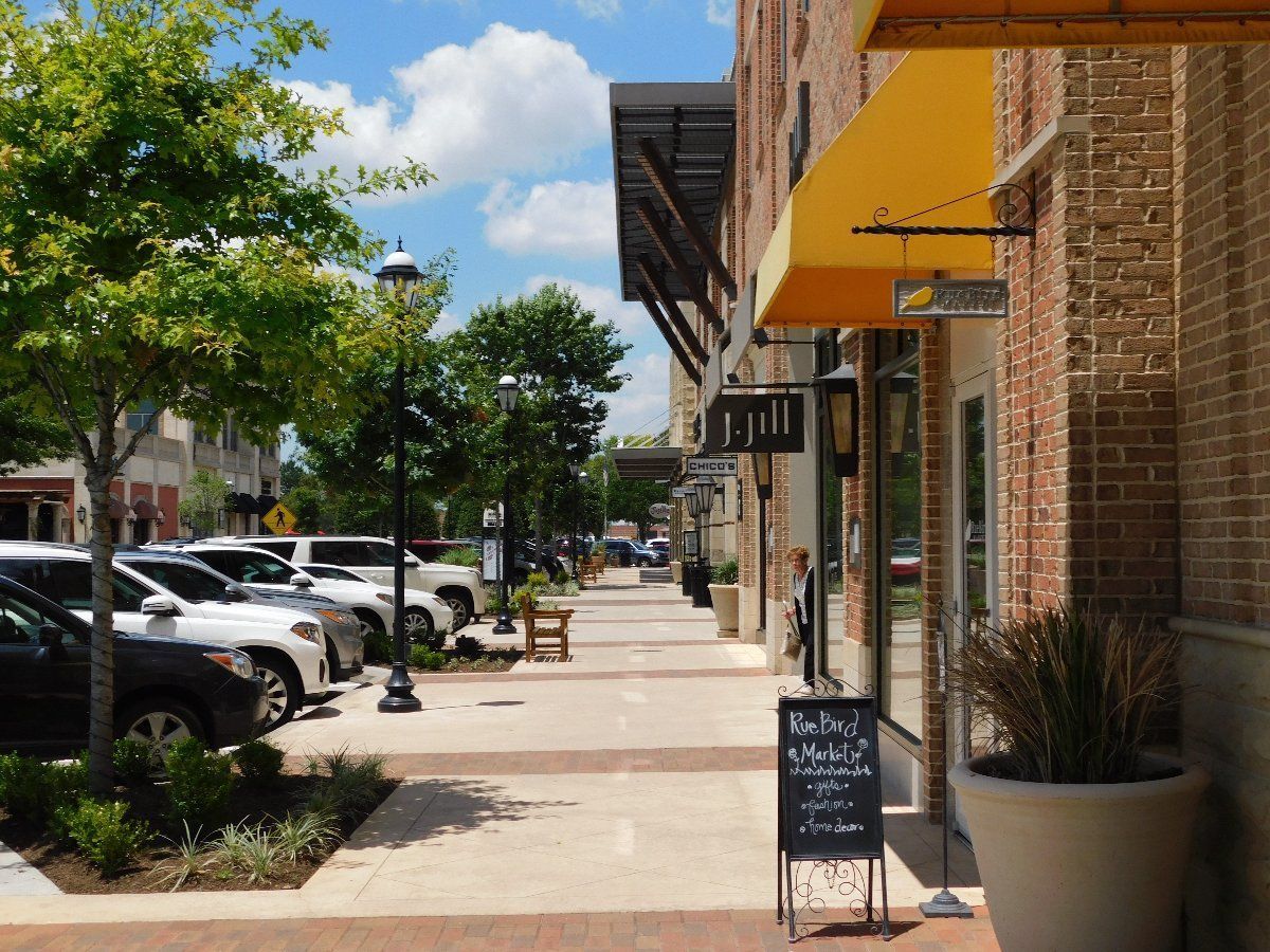 A brick building with a yellow awning on the side of it
