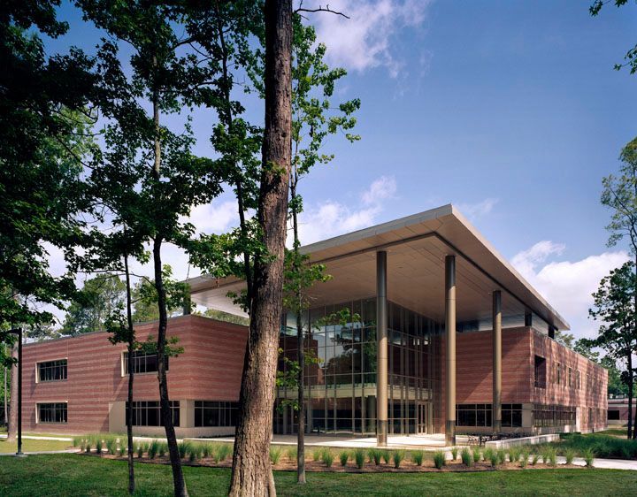 A large brick building with trees in front of it