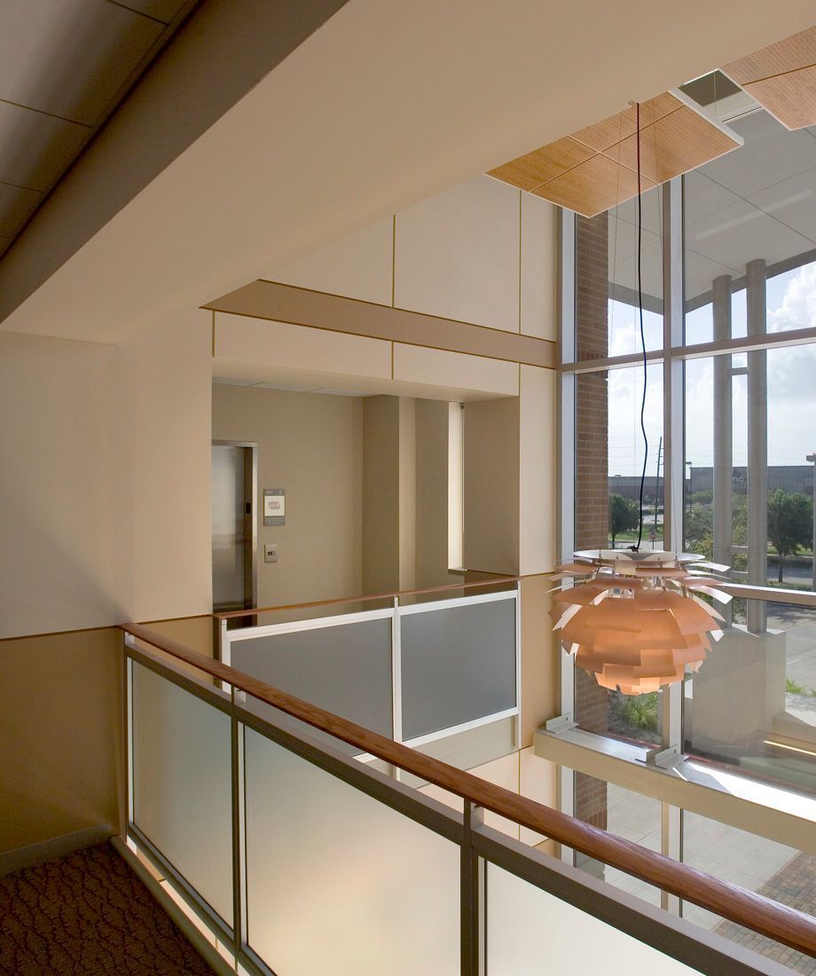 A balcony with a pendant light hanging from the ceiling