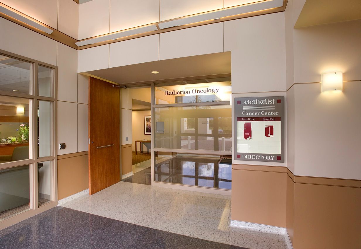 A hallway with a sign that says ' atrium ' on it