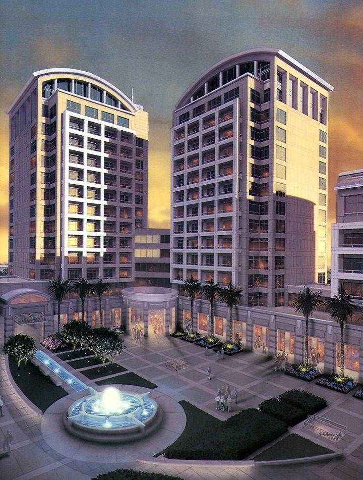 A large building with a fountain in front of it