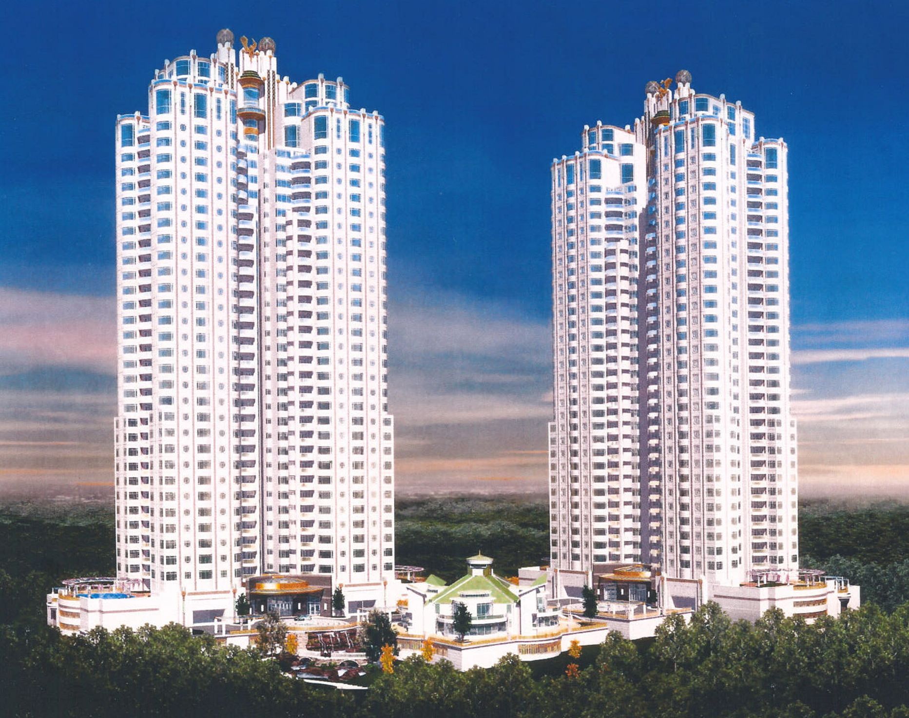 A couple of tall buildings with a blue sky in the background