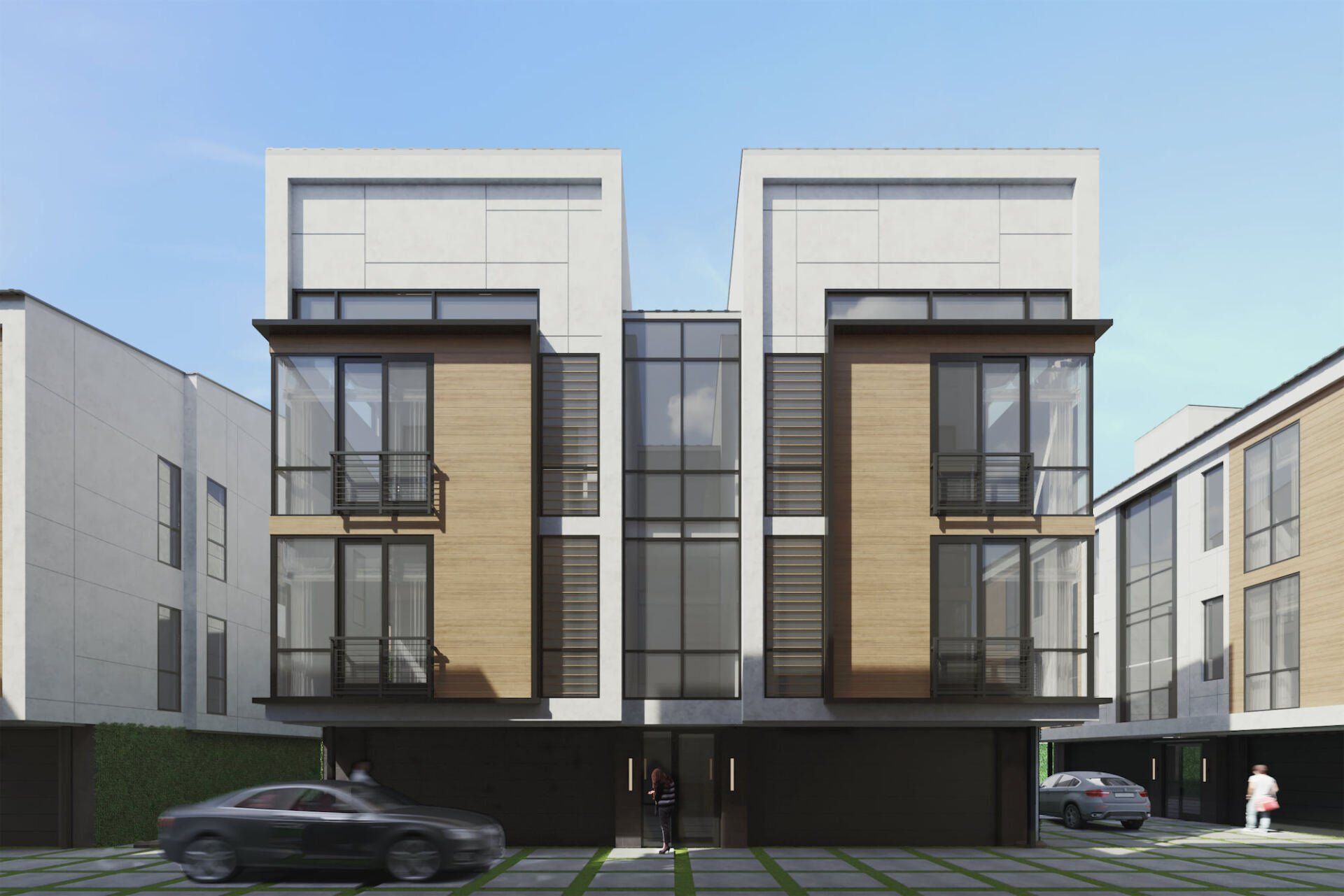 A car is parked in front of a building with a lot of windows