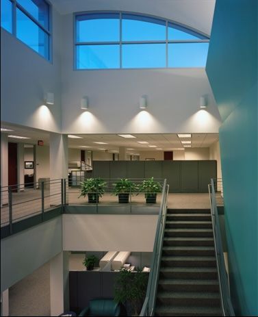 A building with stairs leading up to the second floor