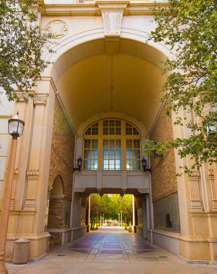 A building with a large archway leading to a courtyard