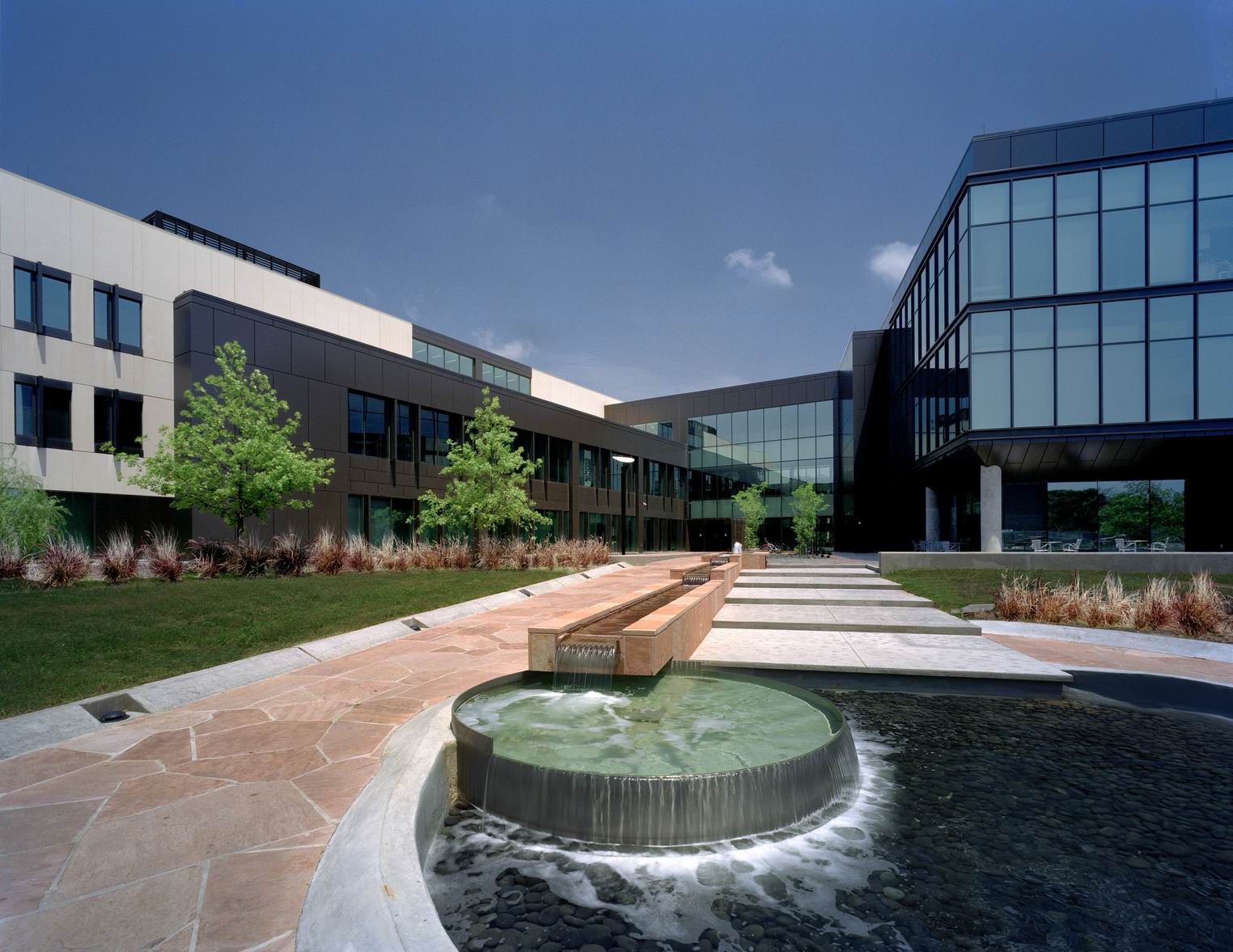 A large building with a fountain in front of it