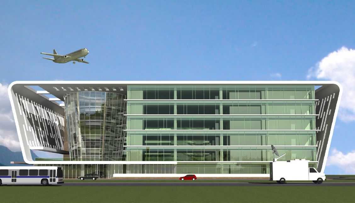 An airplane is flying over a large building