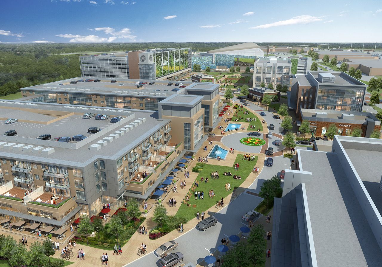 An aerial view of a city with lots of buildings and trees