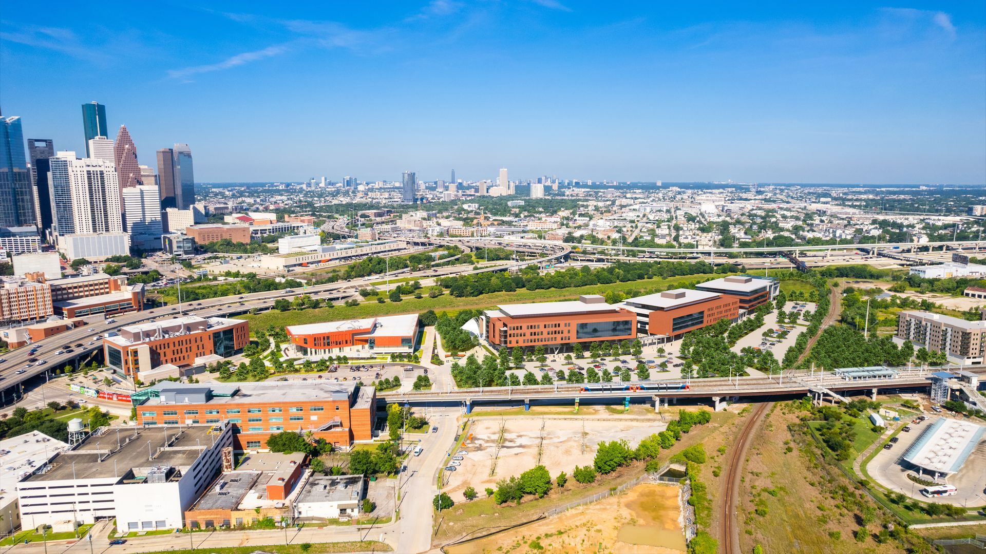 An aerial view of a city with a lot of buildings and trees.