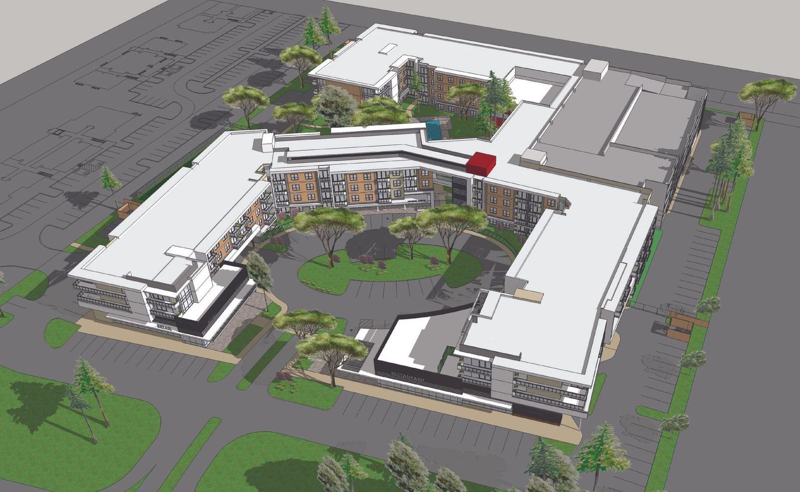 An aerial view of a large building surrounded by trees