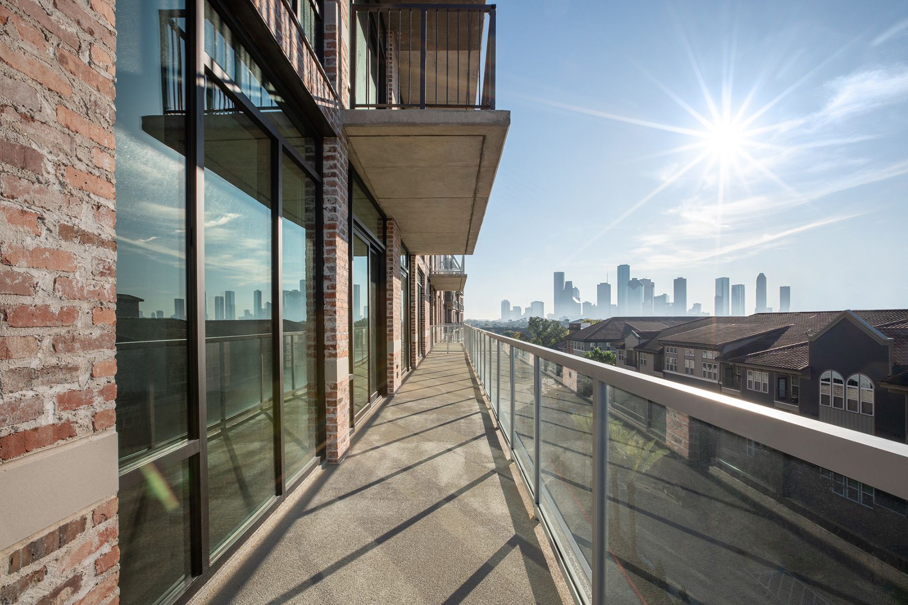 A balcony with a view of the city skyline