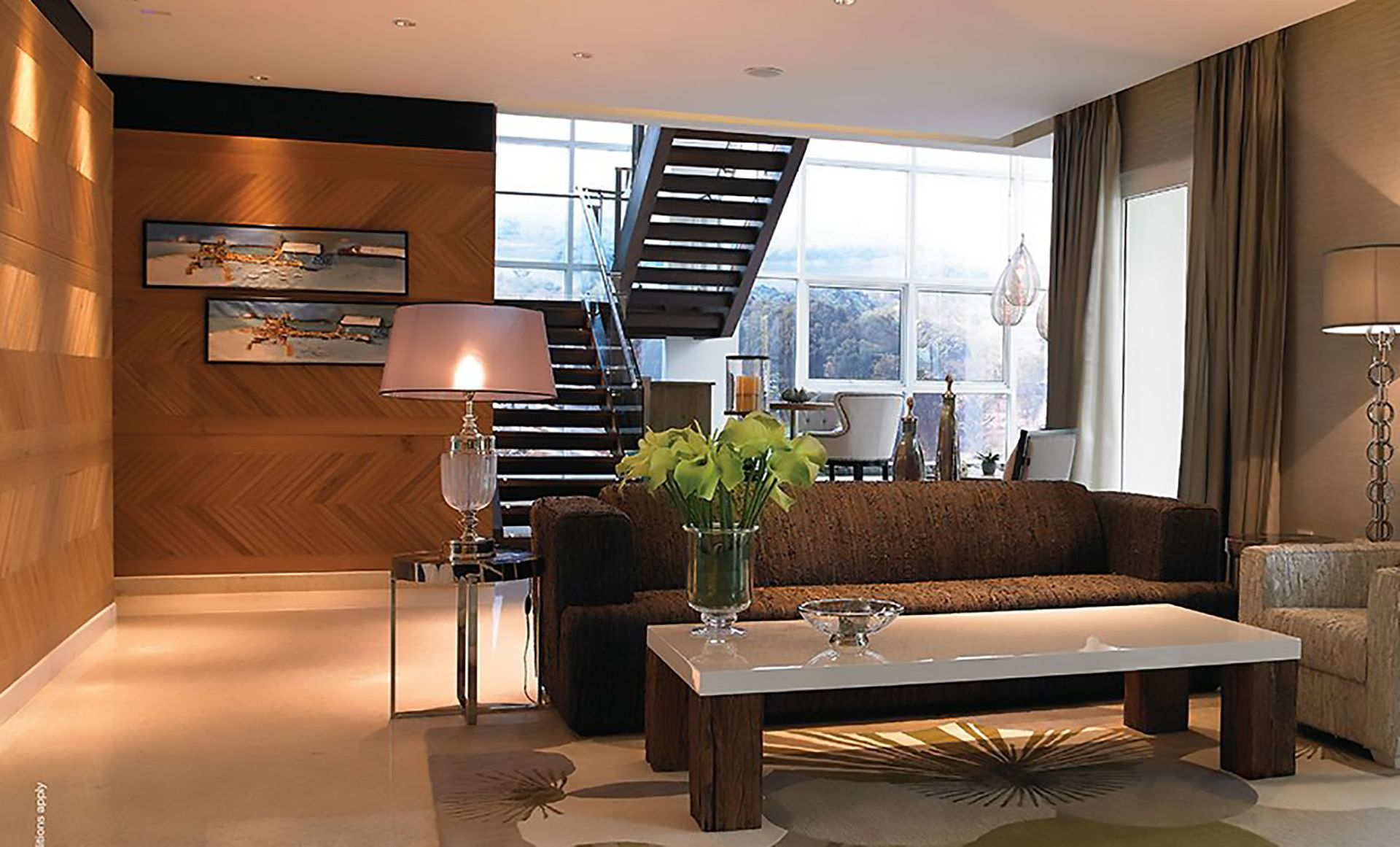 A living room with a staircase and a couch