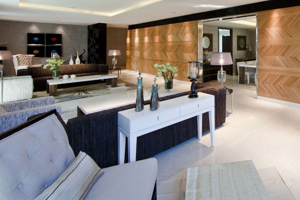 A living room with a couch a chair and a table