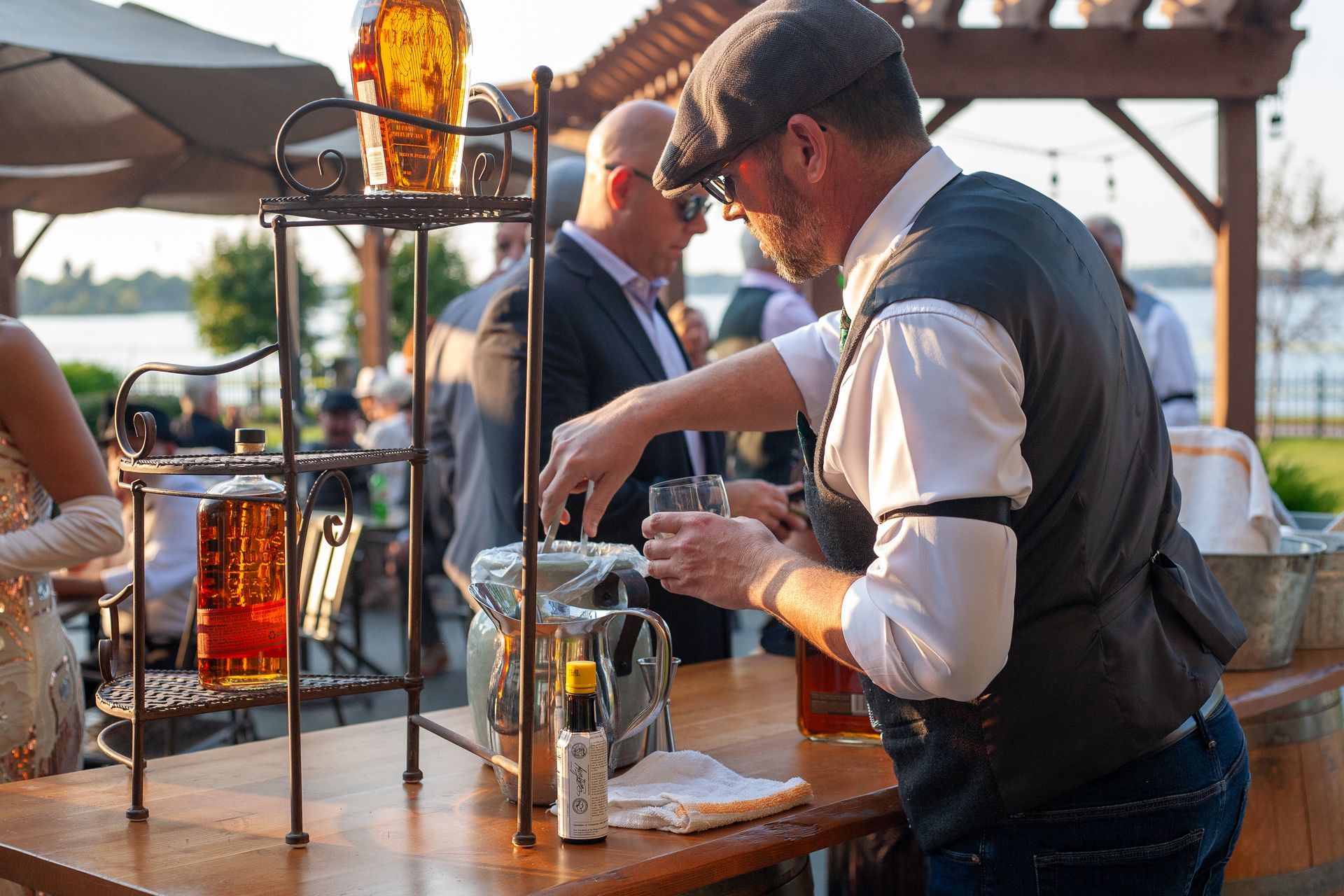 A man is pouring beer into a glass at a bar.